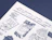 Close-up of white tissue paper with a navy hand-drawn illustration and lettering print