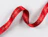 A red satin ribbon printed with 'La myosotis' cursive typography curling across a white background