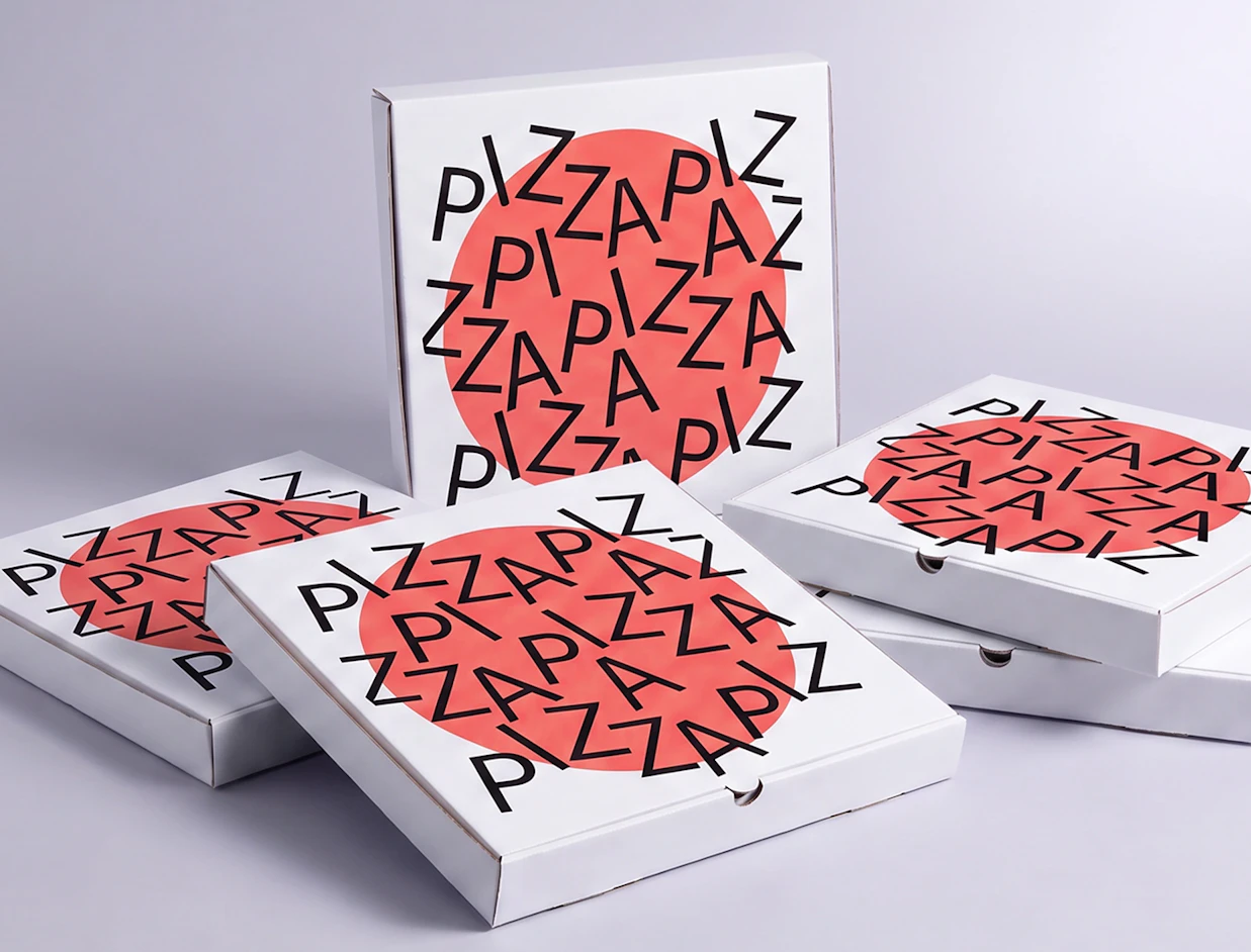 Multiple white pizza boxes stacked together, decorated with a red central circle and black typography repeating the word 'PIZZA'