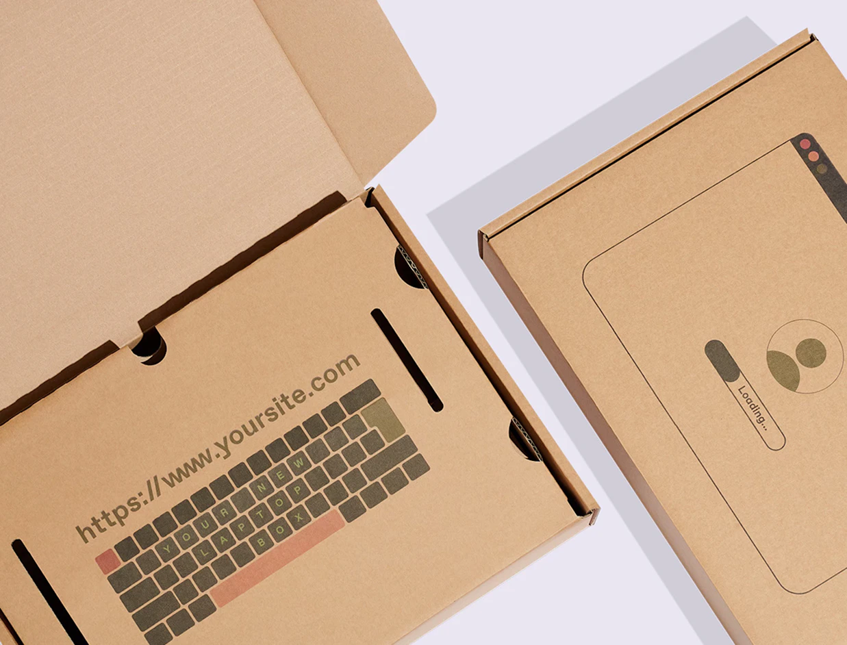 Top-down view of custom laptop cardboard boxes showing a printed keyboard design inside the open lid