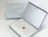 An open grey rigid presentation box branded 'INGLOT 40 years of celebrating your beauty' with custom branded tissue paper and a red wax seal