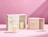 Two sliding drawer candle boxes branded 'Maison Solenne' displaying glass candle jars decorated with gold dots against a pink backdrop
