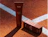 A brown tube of Sord Foaming Face Wash standing next to its box on an orange running track