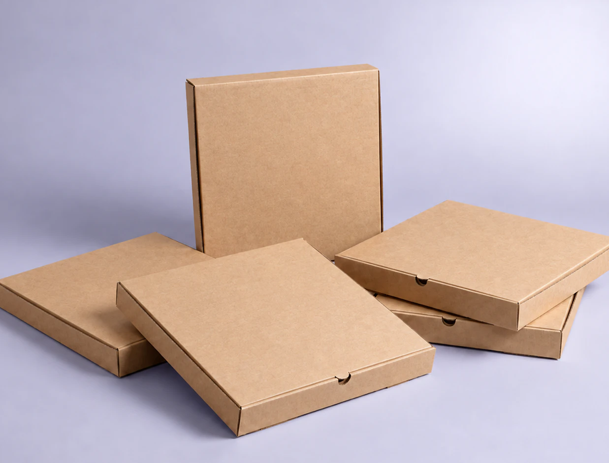 Multiple plain brown kraft cardboard pizza boxes stacked together against a light purple background