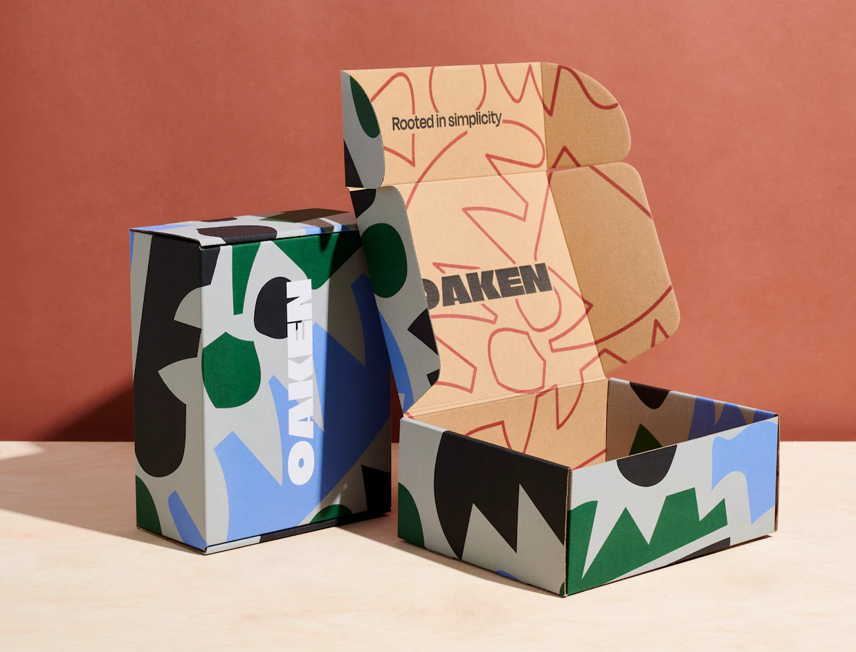 Open eco colour mailer boxes with bold multicolour graphic prints outside and inside