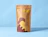 A kraft paper ziplock pouch printed with yellow and burgundy abstract graphics and 'Hello! Is it me you're looking for?' against a light blue background
