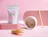 A white stand-up pouch labeled 'MATCHA GRACIAS' displayed on a pink background alongside a ceramic matcha bowl, bamboo whisk, and scoop