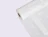 A large roll of white honeycomb paper wrap used for eco-friendly product packaging