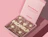 Open pink full colour mailer box with a printed message inside the lid, holding a chocolate bar