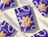 Flat lay of purple snack pouches with euro-hang tabs and a flower-shaped clear window revealing cashew nuts inside