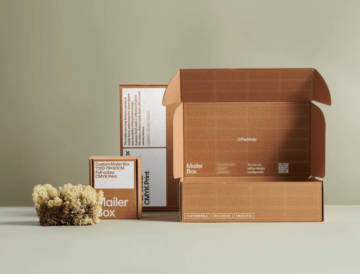 Kraft mailer boxes with white print, one open to show the printed interior, on a sage backdrop