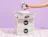 Hand taking a can from an open white shipping box with a black print on a lilac background