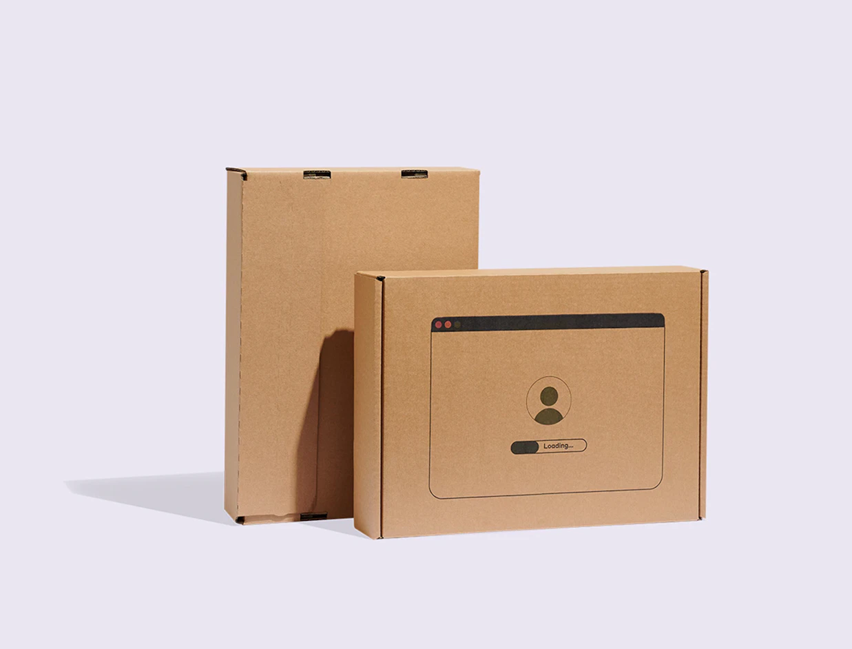 Two kraft cardboard laptop shipping boxes featuring a printed computer window illustration with a loading bar on a white background