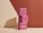 Three red and purple geometric patterned boxes labeled 'Orion' stacked vertically on a wooden table