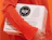 Person carrying white shipping boxes with a black circular logo print