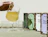 A hand pouring tea from a glass pitcher into a glass cup next to four colorful 'teaseme' tea packaging boxes on a table