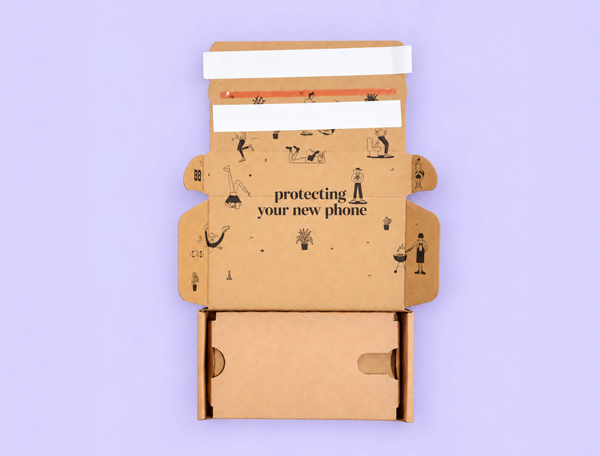 Top-down view of an open kraft cardboard phone box printed inside with illustrations and 'protecting your new phone' on a purple background