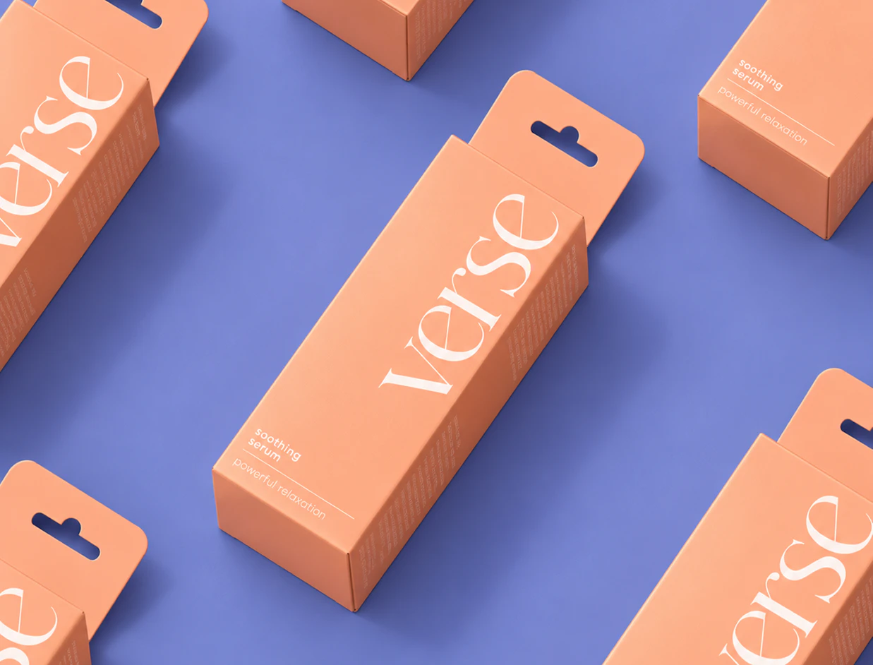 A flat lay of peach-colored 'verse' skincare boxes with euro-hang tabs on a purple background