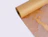 A roll of brown kraft paper with cut-out honeycomb protective mesh unrolling against a white background