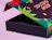 Partially open dark gift box with festive green and red graphics reading 'BREW CHRISTMAS'
