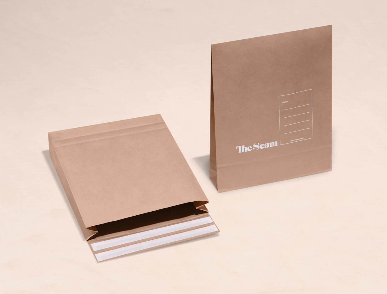 Two expandable kraft mailers with a white print, one open to show the adhesive seal strip