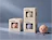 Three beige NŌRA bath bomb boxes with cutout windows displaying textured bath bombs inside, set against a muted blue backdrop
