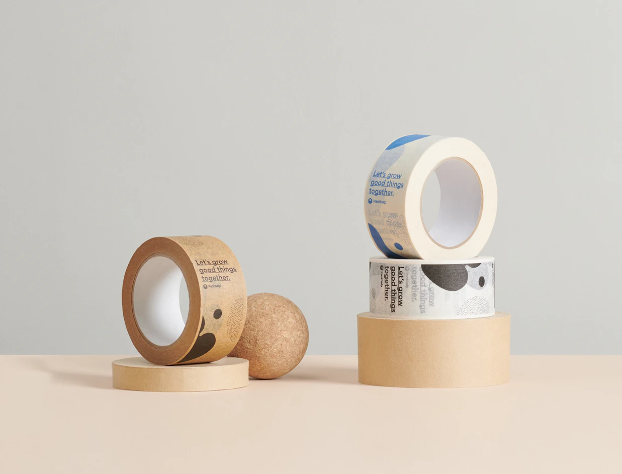 Custom rolls of printed paper tape featuring graphics and 'Let's grow good things together' text on circular displays