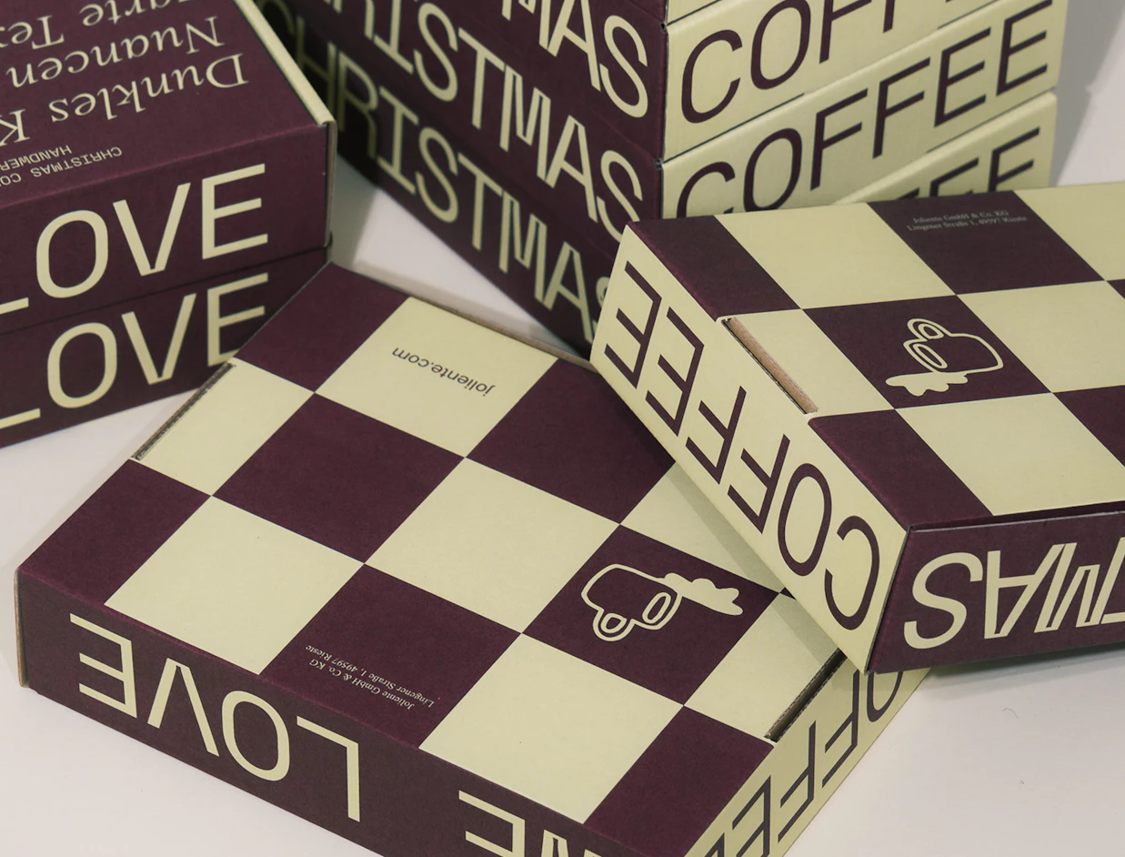 Eco colour mailer boxes with a burgundy and cream checkerboard and lettering print