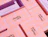 Multiple pink gift boxes with a light purple grid pattern and 'chunky nest' logo spread out on a surface